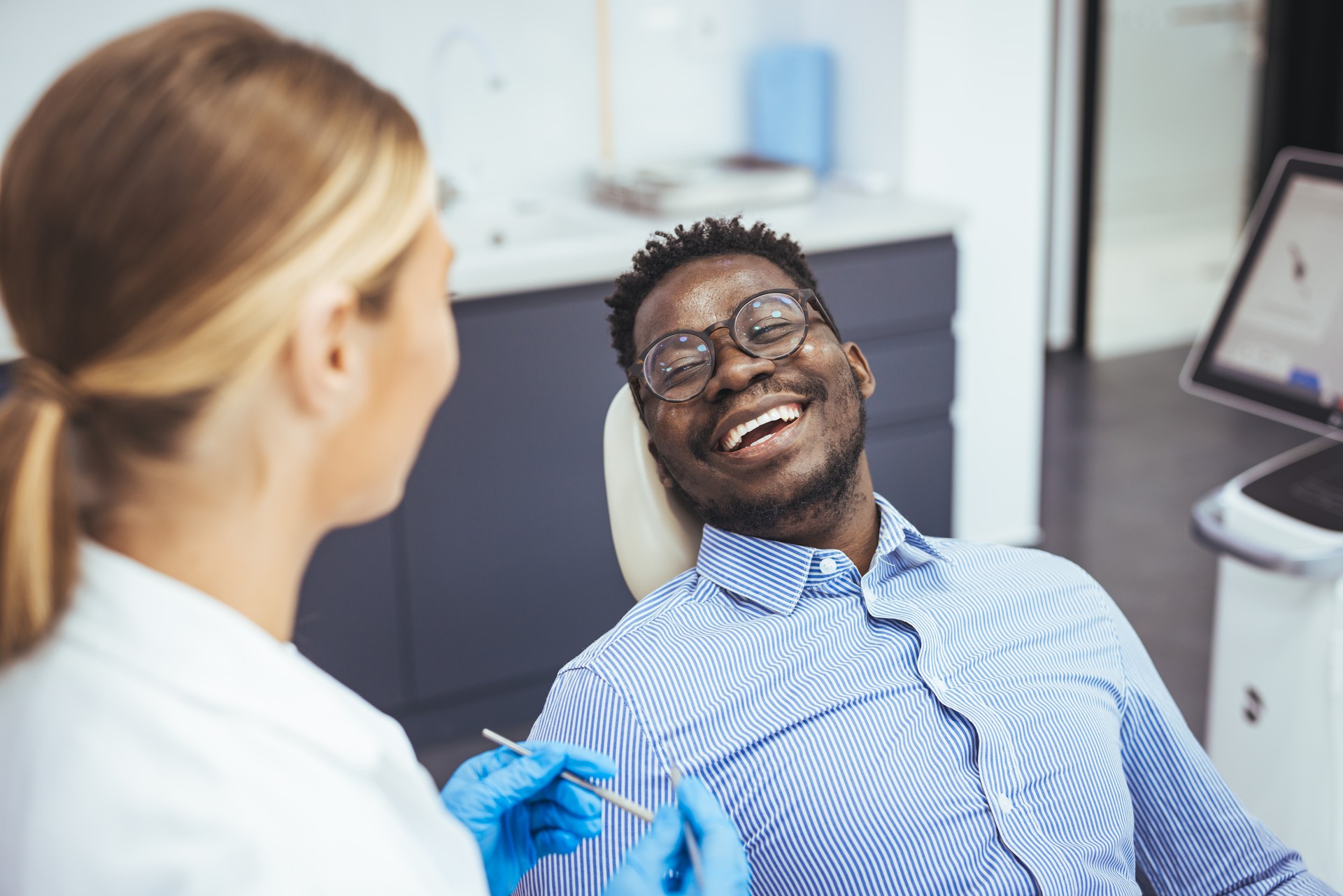 Man having teeth examined at dentists.